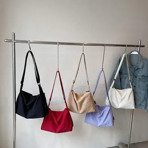 Minimalist canvas crossbody bags with BNT embroidery in multiple casual colors