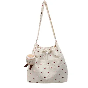 Summer mesh drawstring shoulder bag with red bow print and cute plush pendant charm