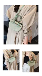Detail of light green woven saddle bag with metallic buckle and polka dot pattern