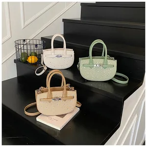 Detailed view of woven saddle bags with shimmering rhinestones and silver metal locks