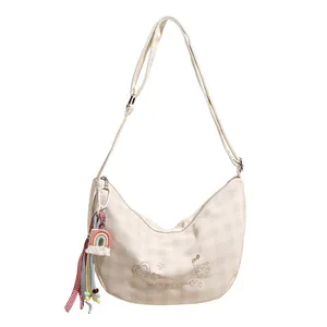 Sac bandoulière beige à carreaux avec broderies cartoon et pompon arc-en-ciel