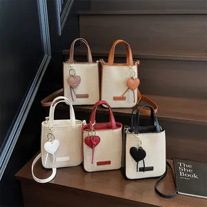 Fashionable denim canvas mini tote bags with leather trim and heart charm in five colors