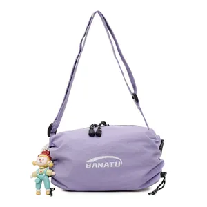 Minimalist light purple crossbody dumpling bag with adjustable strap and cute doll pendant