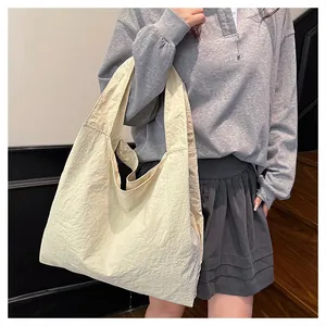 Detailed view of cream-white large capacity tote bag with natural pleated texture