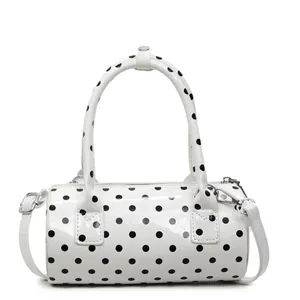 Chic white cylinder handbag with black polka dots and shiny finish for women