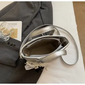 Top view of bucket bag interior featuring beige lining and a secure zipper pocket