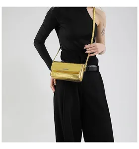 Close-up of gold shoulder bag with crocodile texture and Fashion & Bags text logo