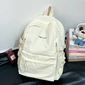 Minimalist beige campus backpack with embroidery and large capacity for travel and school