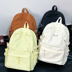 Large capacity school backpack in orange black yellow and white with nylon texture