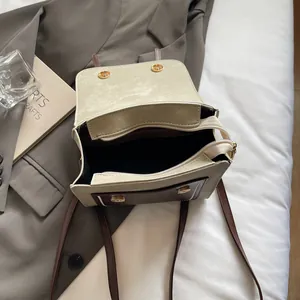 Retro canvas and leather satchel with dual compartments and adjustable brown strap