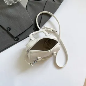 White lychee pattern mini Boston bag with silver hardware and adjustable crossbody strap
