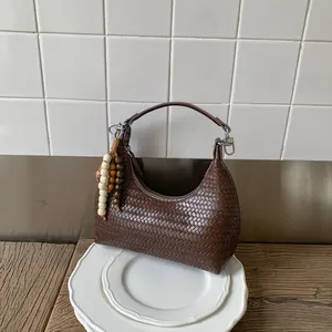 Classic dark brown woven leather shoulder bag with vintage wooden bead charm for women