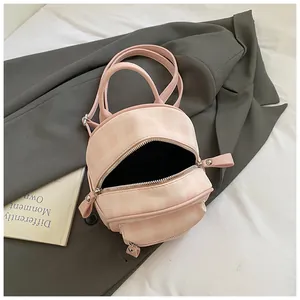 Pink checkered mini backpack made of synthetic leather with dual zipper compartments