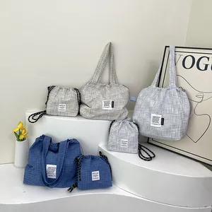 Summer Korean style plaid tote and drawstring bag set in minimalist storage setup