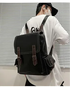 Detail of high-quality leather backpack with brown straps and white stitching