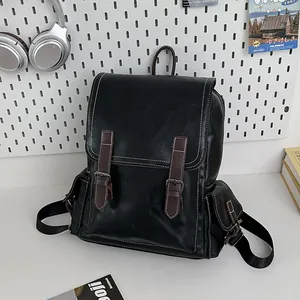 Fashionable black PU leather backpack with vintage buckles and large storage capacity