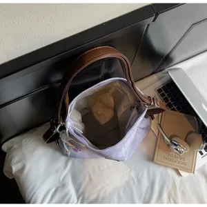Detailed interior view of a lilac tote bag with organized compartments and laptop accessories