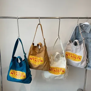 Casual canvas tote bags for students in four colors with adjustable shoulder straps