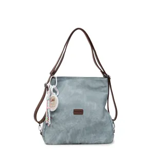 Light blue canvas tote bag with brown leather straps and cute capybara pendant charm