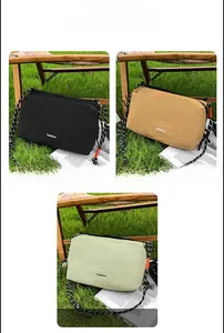Detailed view of nylon crossbody bags in black, brown and green with woven strap cords