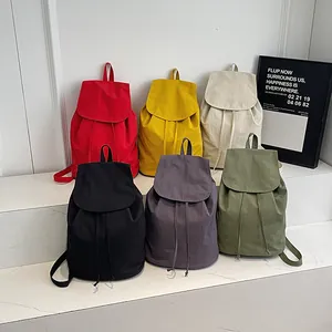 Fashionable drawstring canvas backpacks in six colors including red yellow and green