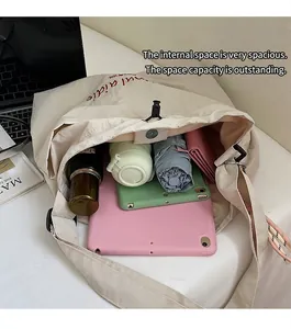 Top view showing the spacious interior of a beige tote bag filled with daily essentials