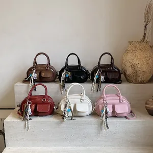 Retro mini Boston baguette bags in six colors with stylish ribbon pendants and front pockets
