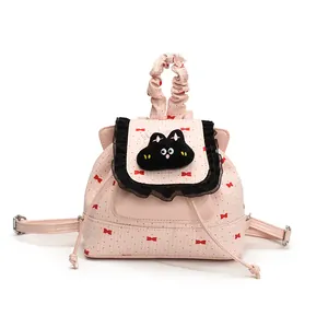 Mini sac à dos rose pour femmes avec motifs nœuds rouges et bordure en dentelle noire