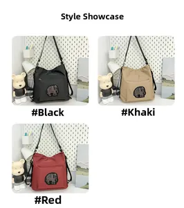 Three large tote bags in black, khaki, and red with embroidered elephant patches