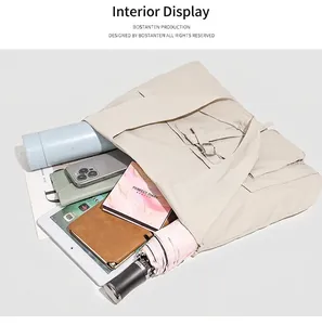 Detailed view of the off-white tote bag interior showing ample storage for daily essentials