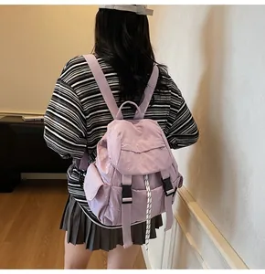Light purple nylon backpack with textured fabric and buckle closure shown from back view
