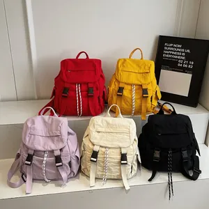 Minimalist waterproof nylon backpack in five colors for school, travel, and yoga sports