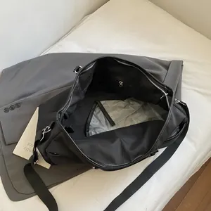 Large black travel bag for gym and luggage with adjustable strap and spacious interior