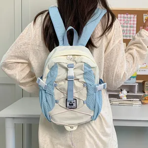 Mini sac à dos de randonnée léger beige et bleu avec sangles pour voyage en plein air