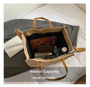 Internal capacity view of beige tote bag showing tablet, phone and cosmetics space