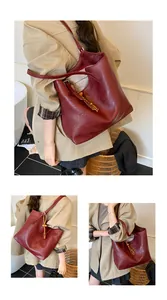 Detail of burgundy tote bag in shiny PU leather featuring a wooden bead tassel charm