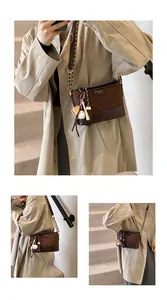 Detail of vintage brown quilted bucket bag with golden chain and baseball charm