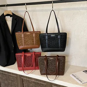 Collection of stylish leopard print tote bags with minimalist straps in various colors