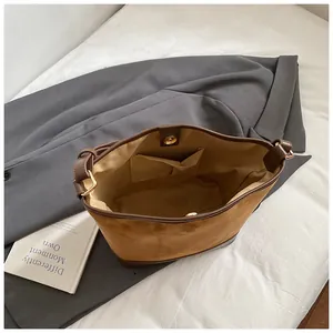 Vintage caramel matte leather bucket bag with large capacity and magnetic buckle
