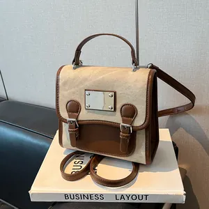 Retro-Rucksack aus Canvas und braunem Leder mit Doppel-Schnallen-Design und Tragegriff oben