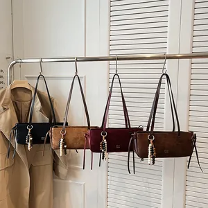 Collection of four matte leather shoulder bags in black, brown, burgundy, and tan colors