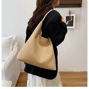 Close-up of woven bucket bag featuring detailed V-shape texture in a minimalist urban style