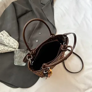 Fashionable leopard print bucket bag with double ring handles and detachable strap