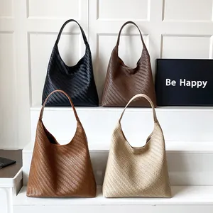 Minimalist woven hobo tote bags in black, brown, and cream with refined textures