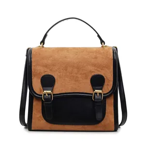 Retro vintage brown suede and black faux leather tote handbag with metal buckle detail