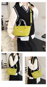 Detail of lime green nylon crossbody bag with grey rope handle and wide strap