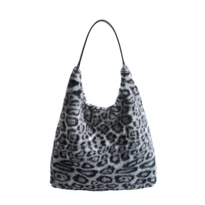 Faux fur leopard print hobo bag with large capacity and sleek black shoulder strap