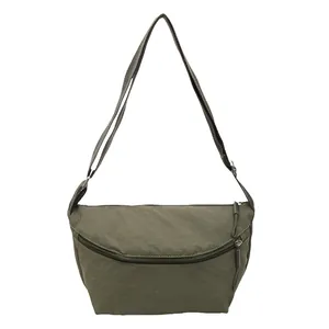 Minimalist army green nylon crescent shoulder bag with adjustable strap and dual zippers