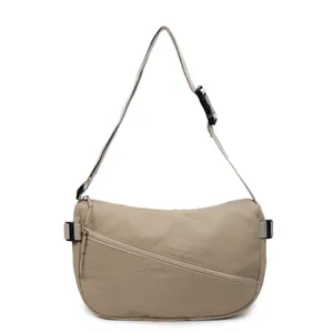 Minimalist large capacity khaki crossbody bag with adjustable strap and front zipper pocket