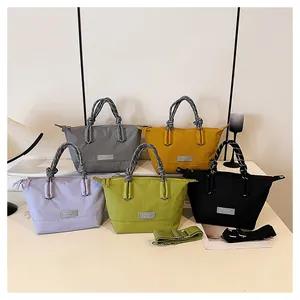 Group display of chic nylon tote bags in five vibrant colors with stylish woven handles